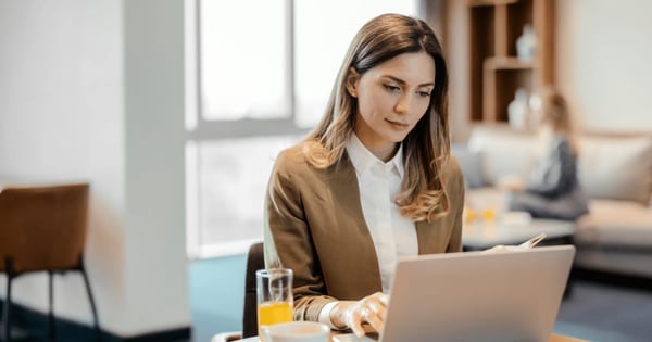 Woman using laptop to encrypt emails