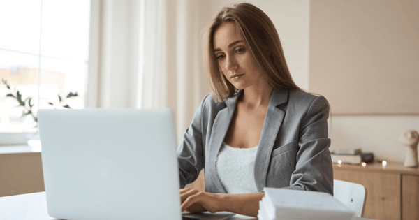 Woman using laptop to secure emails